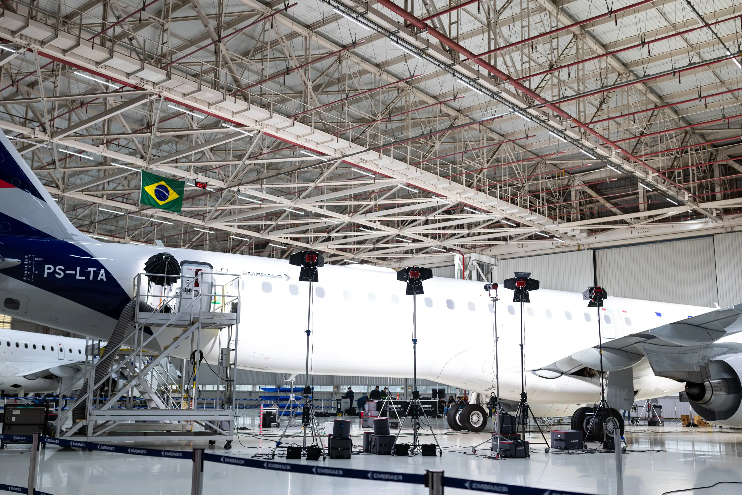 The E2 in profile, registration PS-LTA, under the hangar lights